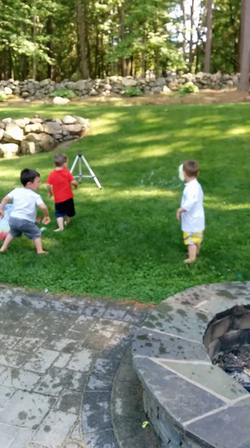 KID THROWS WATER BALLOON KID THROWS WATER BALLOON