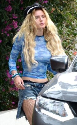 Bella Thorne Stunning In Fishnets And Daisy Dukes