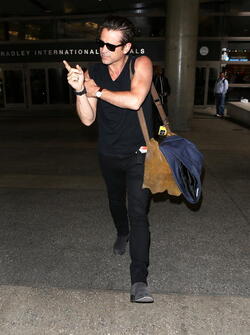 Colin Farrell was spotted in a sleeveless t shirt at LAX