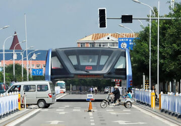 Futuristic Straddling Bus Now Collecting Dust