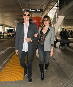 Milla Jovovich and husband director Paul W. S. Anderson were spotted returning to Los Angeles at LAX.
