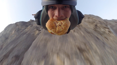 HAMBURGER AND FLIES HILARIOUS MOMENT BASE JUMPER OFF OFF THE SIDE OF A CLIFF WHILE EATING HIS LUNCH with video 