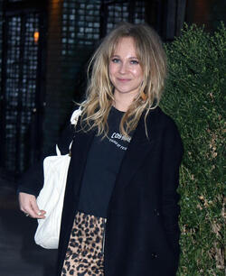 Juno Temple is pictured chatting on a cellphone outside her hotel in New York City.