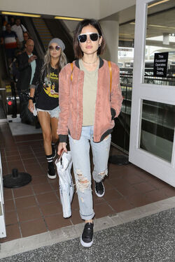 Pretty Little Liars star Lucy Hale looks cute in a rose colored silk bomber light green tee ripped jeans and black tennis shoes as she touches down in L.A. after a long flight from NYC. Pretty Little Liars star Lucy Hale looks cute in a rose colored silk bomber light green tee ripped jeans and black tennis shoes as she touches down in L.A. after a long flight from NYC.