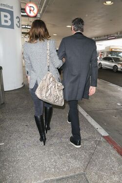 Milla Jovovich and husband director Paul W. S. Anderson were spotted returning to Los Angeles at LAX.
