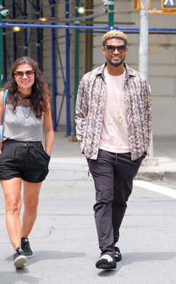 Usher wears comical slippers as he walks in Tribeca