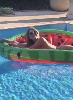 Liz Hurley poses totally nude on a slice of watermelon Liz Hurley poses totally nude on a slice of watermelon