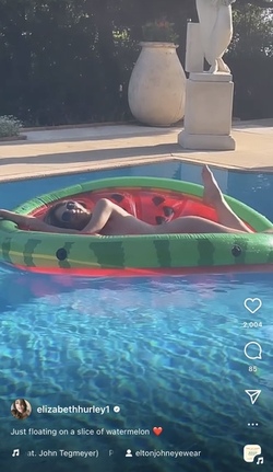 Liz Hurley poses totally nude on a slice of watermelon Liz Hurley poses totally nude on a slice of watermelon