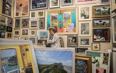 Sophie Miller of the Llewellyn Alexander gallery in Waterloo sifts through the approximately 600 works of art that has been rejected from the annual prestigious Royal Academy exhibition Sophie Miller of the Llewellyn Alexander gallery in Waterloo sifts through the approximately 600 works of art that has been rejected from the annual prestigious Royal Academy exhibition