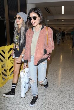 Pretty Little Liars star Lucy Hale looks cute in a rose colored silk bomber light green tee ripped jeans and black tennis shoes as she touches down in L.A. after a long flight from NYC. Pretty Little Liars star Lucy Hale looks cute in a rose colored silk bomber light green tee ripped jeans and black tennis shoes as she touches down in L.A. after a long flight from NYC.