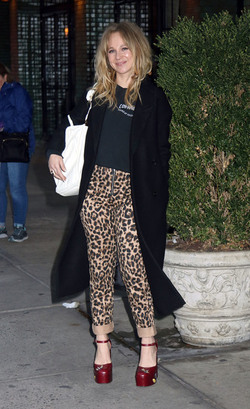 Juno Temple is pictured chatting on a cellphone outside her hotel in New York City.
