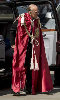 Queen Elizabeth II and Prince Philip Duke of Edinburgh attend a service to mark the 100th anniversary of the Order of the British Empire at St Paul s Cathedral in London.