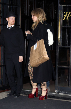 Juno Temple is pictured chatting on a cellphone outside her hotel in New York City.