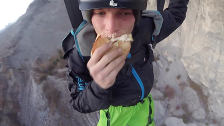 HAMBURGER AND FLIES HILARIOUS MOMENT BASE JUMPER OFF OFF THE SIDE OF A CLIFF WHILE EATING HIS LUNCH with video 