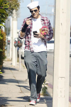Johnny Knoxville Accesorizes with Sailor Hat and Wrist Brace