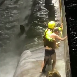 VIDEO Foolish man who went for night time swim in treacherous sea is saved by hero firefighters who dived in after him