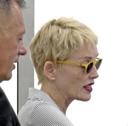 Sharon Stone Shows New Pixie Do Sports Pinstripe Suit At LAX Sharon Stone Shows New Pixie Do Sports Pinstripe Suit At LAX