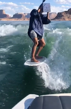 HIGH SCHOOL GRADUATE TAKES UNIQUE GRADUATION PHOTOS WHILE WAKESURFING