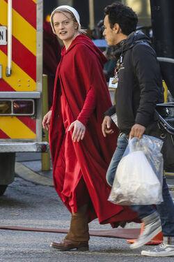 EXCLUSIVE Elisabeth Moss in Costume as Offred in The Handmaid s Tale Filming in Toronto.