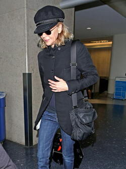 Meg Ryan Tries To Keep A Low Profile Arriving In L.A. After CFDA Awards
