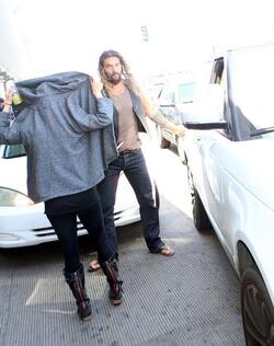 Jason Momoa Clutches His Favorite Pillow Going Through LAX TSA