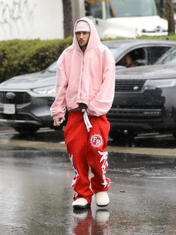Disheveled Justin Bieber goes go karting in the rain