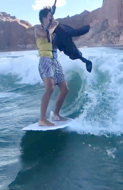 HIGH SCHOOL GRADUATE TAKES UNIQUE GRADUATION PHOTOS WHILE WAKESURFING