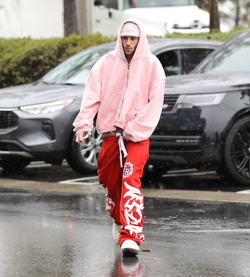 Disheveled Justin Bieber goes go karting in the rain