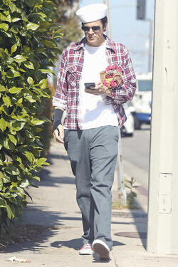 Johnny Knoxville Accesorizes with Sailor Hat and Wrist Brace