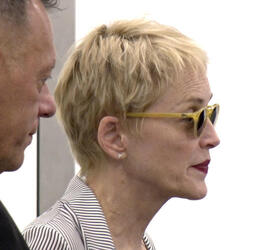 Sharon Stone Shows New Pixie Do Sports Pinstripe Suit At LAX Sharon Stone Shows New Pixie Do Sports Pinstripe Suit At LAX