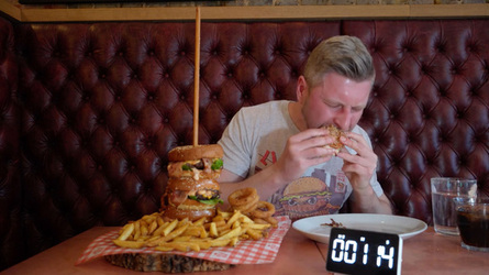 Foodie Smashes Record For Huge Burger Tower Challenge Foodie Smashes Record For Huge Burger Tower Challenge