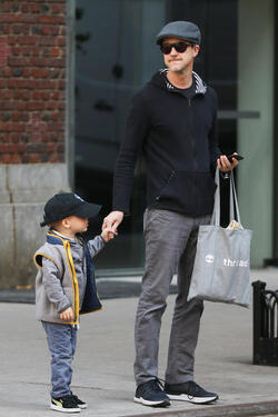 Edward Norton with son hails a taxi in New York City Edward Norton with son hails a taxi in New York City