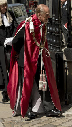 Queen Elizabeth II and Prince Philip Duke of Edinburgh attend a service to mark the 100th anniversary of the Order of the British Empire at St Paul s Cathedral in London.