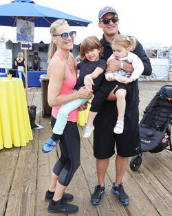 Molly Sims rides a stationary bike for charity