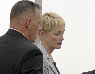 Sharon Stone Shows New Pixie Do Sports Pinstripe Suit At LAX Sharon Stone Shows New Pixie Do Sports Pinstripe Suit At LAX