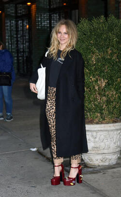 Juno Temple is pictured chatting on a cellphone outside her hotel in New York City.
