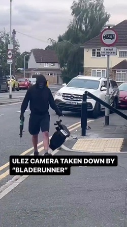 VIDEO Disgruntled masked man hacks down London ULEZ camera in broad daylight 48 hours after it was installed