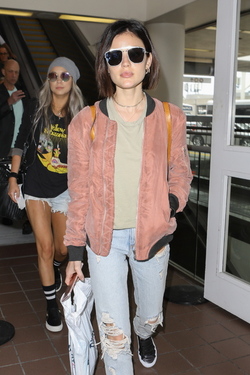 Pretty Little Liars star Lucy Hale looks cute in a rose colored silk bomber light green tee ripped jeans and black tennis shoes as she touches down in L.A. after a long flight from NYC. Pretty Little Liars star Lucy Hale looks cute in a rose colored silk bomber light green tee ripped jeans and black tennis shoes as she touches down in L.A. after a long flight from NYC.