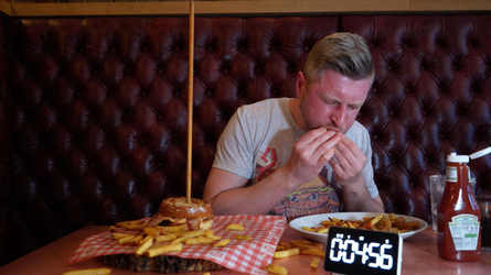 Foodie Smashes Record For Huge Burger Tower Challenge Foodie Smashes Record For Huge Burger Tower Challenge