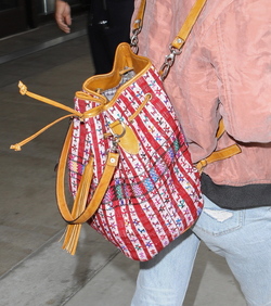 Pretty Little Liars star Lucy Hale looks cute in a rose colored silk bomber light green tee ripped jeans and black tennis shoes as she touches down in L.A. after a long flight from NYC. Pretty Little Liars star Lucy Hale looks cute in a rose colored silk bomber light green tee ripped jeans and black tennis shoes as she touches down in L.A. after a long flight from NYC.