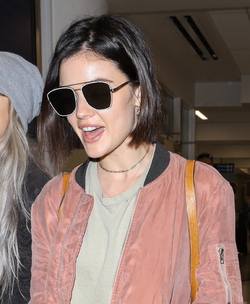 Pretty Little Liars star Lucy Hale looks cute in a rose colored silk bomber light green tee ripped jeans and black tennis shoes as she touches down in L.A. after a long flight from NYC. Pretty Little Liars star Lucy Hale looks cute in a rose colored silk bomber light green tee ripped jeans and black tennis shoes as she touches down in L.A. after a long flight from NYC.