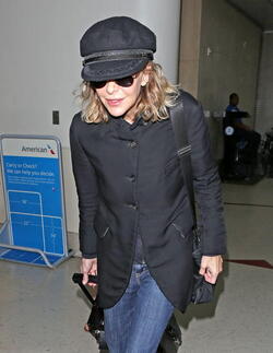 Meg Ryan Tries To Keep A Low Profile Arriving In L.A. After CFDA Awards
