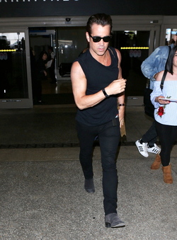 Colin Farrell was spotted in a sleeveless t shirt at LAX