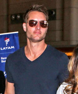 Justin Hartley And Fiance Chrishell Stause Head Out Of LAX On Romantic Holiday