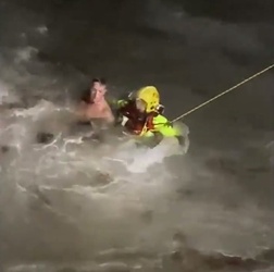 VIDEO Foolish man who went for night time swim in treacherous sea is saved by hero firefighters who dived in after him