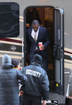 Idris Elba wears a Navy Blue Pinstriped Suit on set of Molly s Game in Toronto