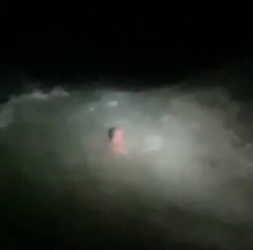 VIDEO Foolish man who went for night time swim in treacherous sea is saved by hero firefighters who dived in after him