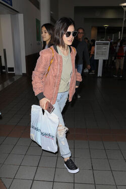 Pretty Little Liars star Lucy Hale looks cute in a rose colored silk bomber light green tee ripped jeans and black tennis shoes as she touches down in L.A. after a long flight from NYC. Pretty Little Liars star Lucy Hale looks cute in a rose colored silk bomber light green tee ripped jeans and black tennis shoes as she touches down in L.A. after a long flight from NYC.
