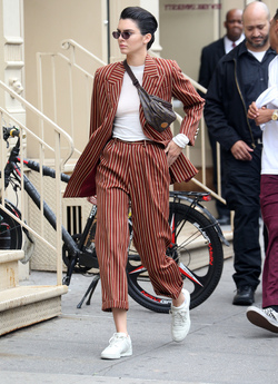 Kendall Jenner Accessorizes a Striped Suit with a Louis Vuitton Fanny Pack Kendall Jenner Accessorizes a Striped Suit with a Louis Vuitton Fanny Pack