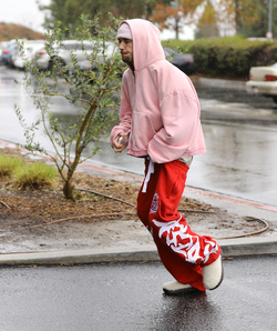 Disheveled Justin Bieber goes go karting in the rain
